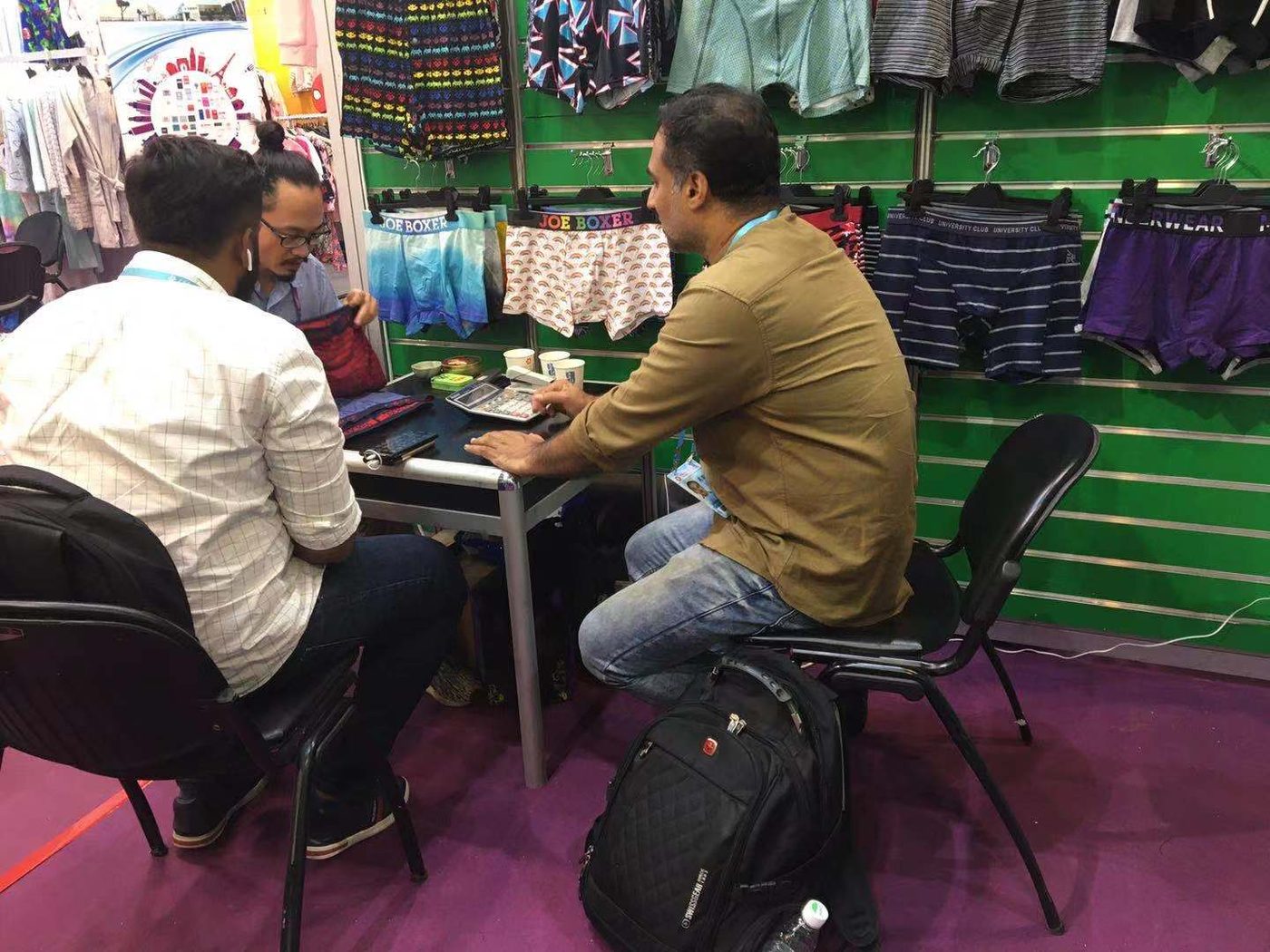 Private-label underwear programs — custom branded collections reviewed with buyers at the trade show booth