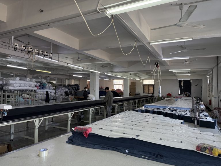 Cutting benches and dies where fabric is cut to the buyer pattern