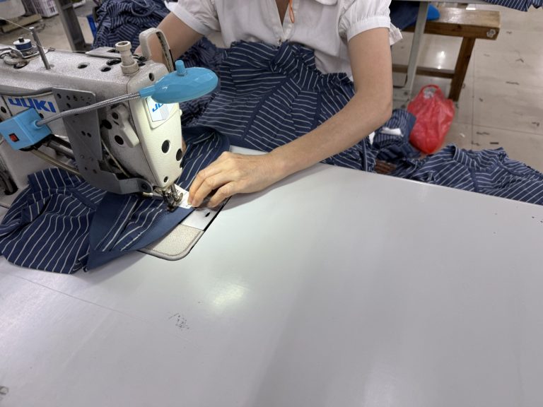 Care labels and size tags attached in line during sewing