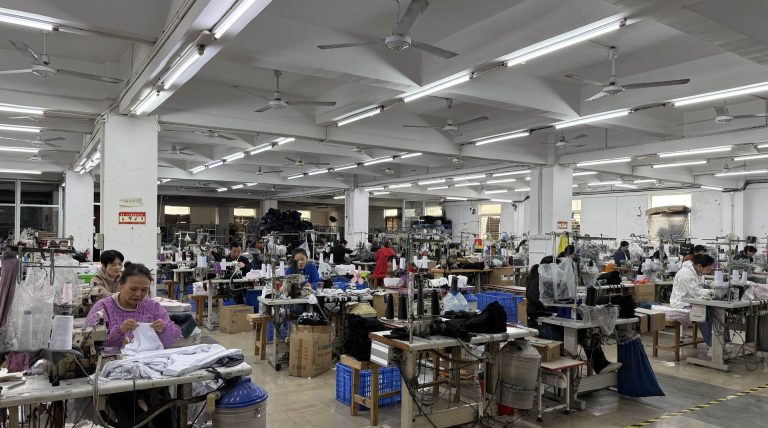Sewing floor at a partner underwear factory: rows of operators at industrial sewing machines