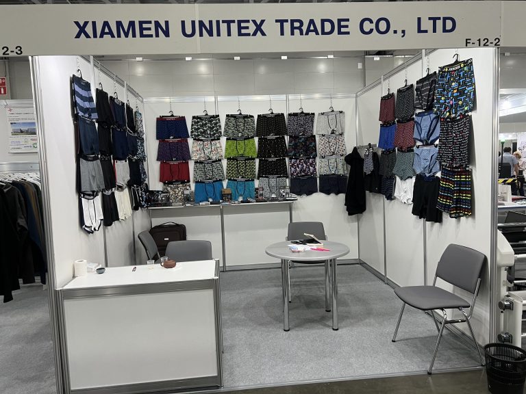 Unitex trade show stand — meeting area with visitors